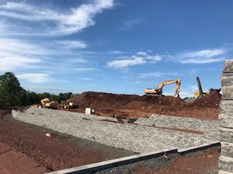 Graded and compacted stone base prepared ahead of paving on a New Jersey site